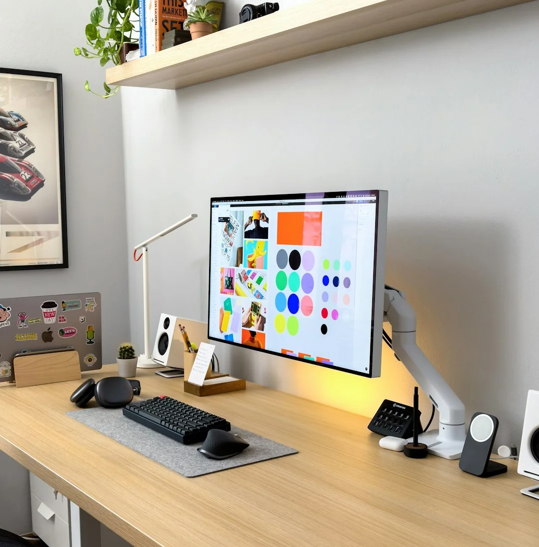services-02 A stylish workspace featuring a laptop and monitors displaying design software.