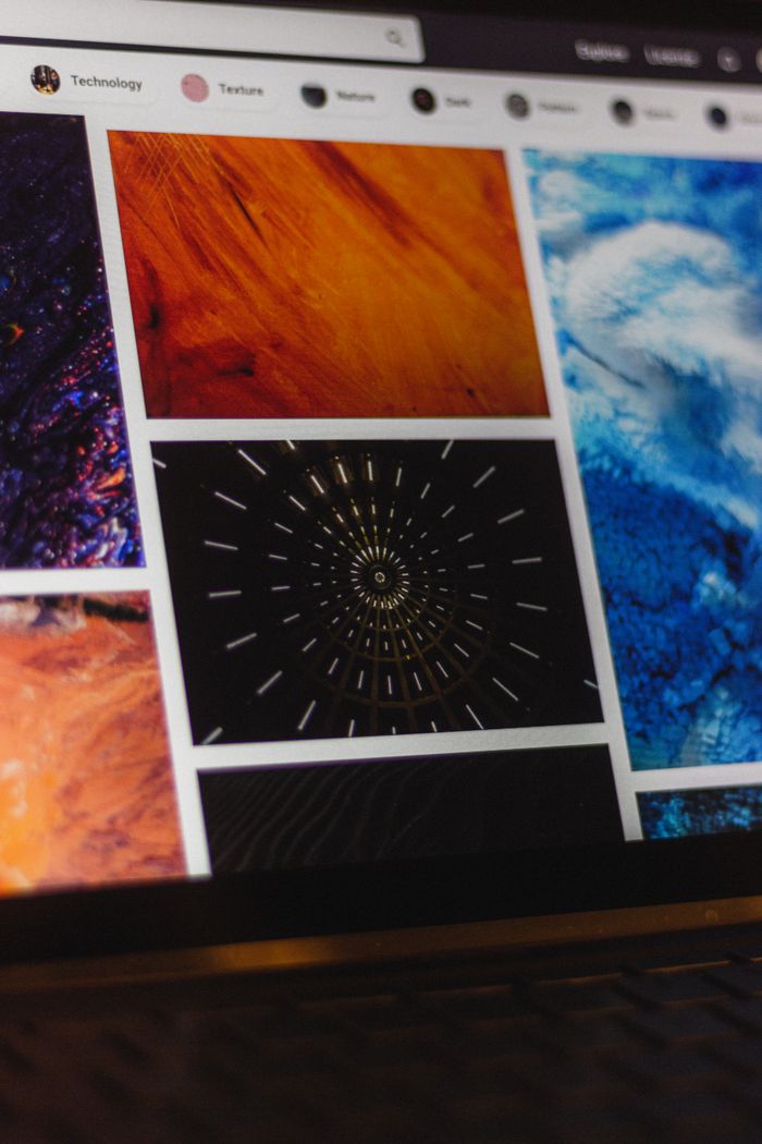 gallery-2 Portable computer with website representing assorted abstract photos under favorites and browser search engine with magnifier symbol
